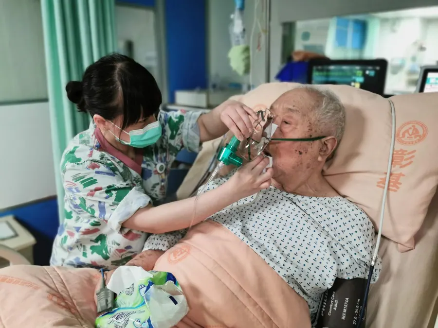 A home ICU setup with patient bed, monitor and oxygen