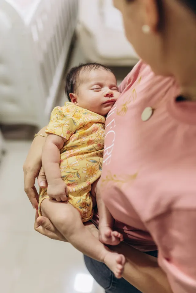 Newborn baby and mother at home